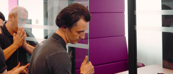 Installify fitter servicing an acoustic office pod panel